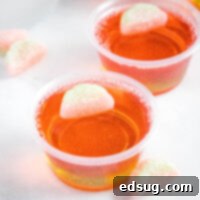 cropped close up of watermelon jello shots on a table