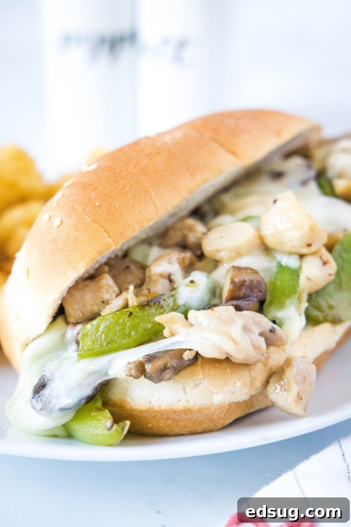 Close up of a chicken Philly cheesesteak on a plate