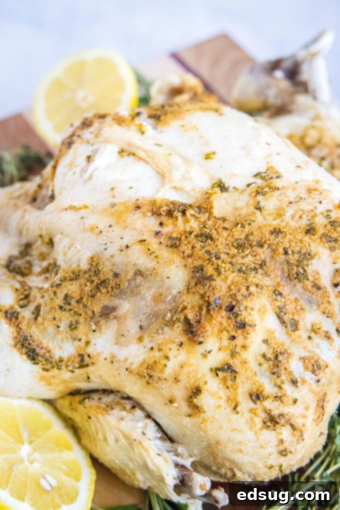 Perfect Instant Pot Whole Chicken 2 Instant Pot whole chicken on a cutting board, ready to be carved