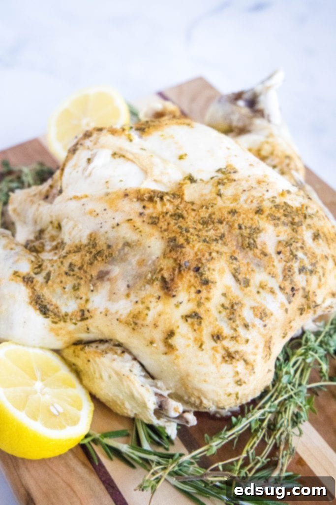 Perfect Instant Pot Whole Chicken 6 Instant Pot whole chicken on a cutting board, garnished