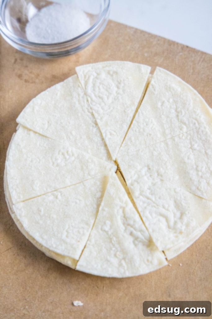 From Scratch Tortilla Chips 5 Corn tortillas neatly sliced into wedges, ready for frying or baking into chips.