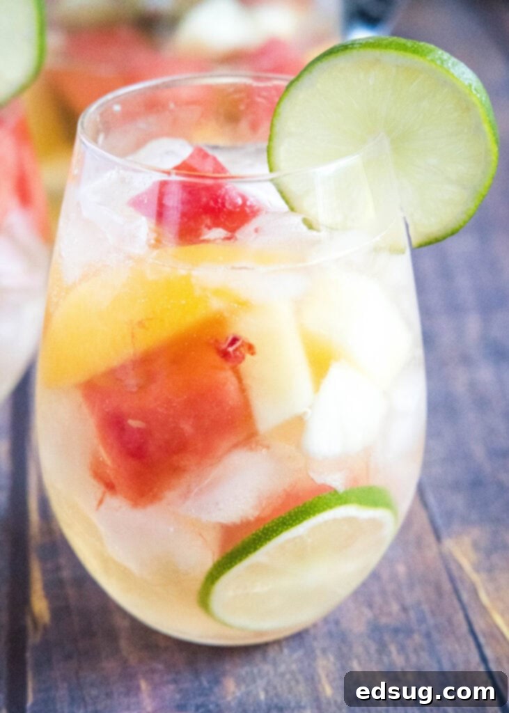 Sun-Drenched Sangria 2 glass of white wine sangria with summer fruit