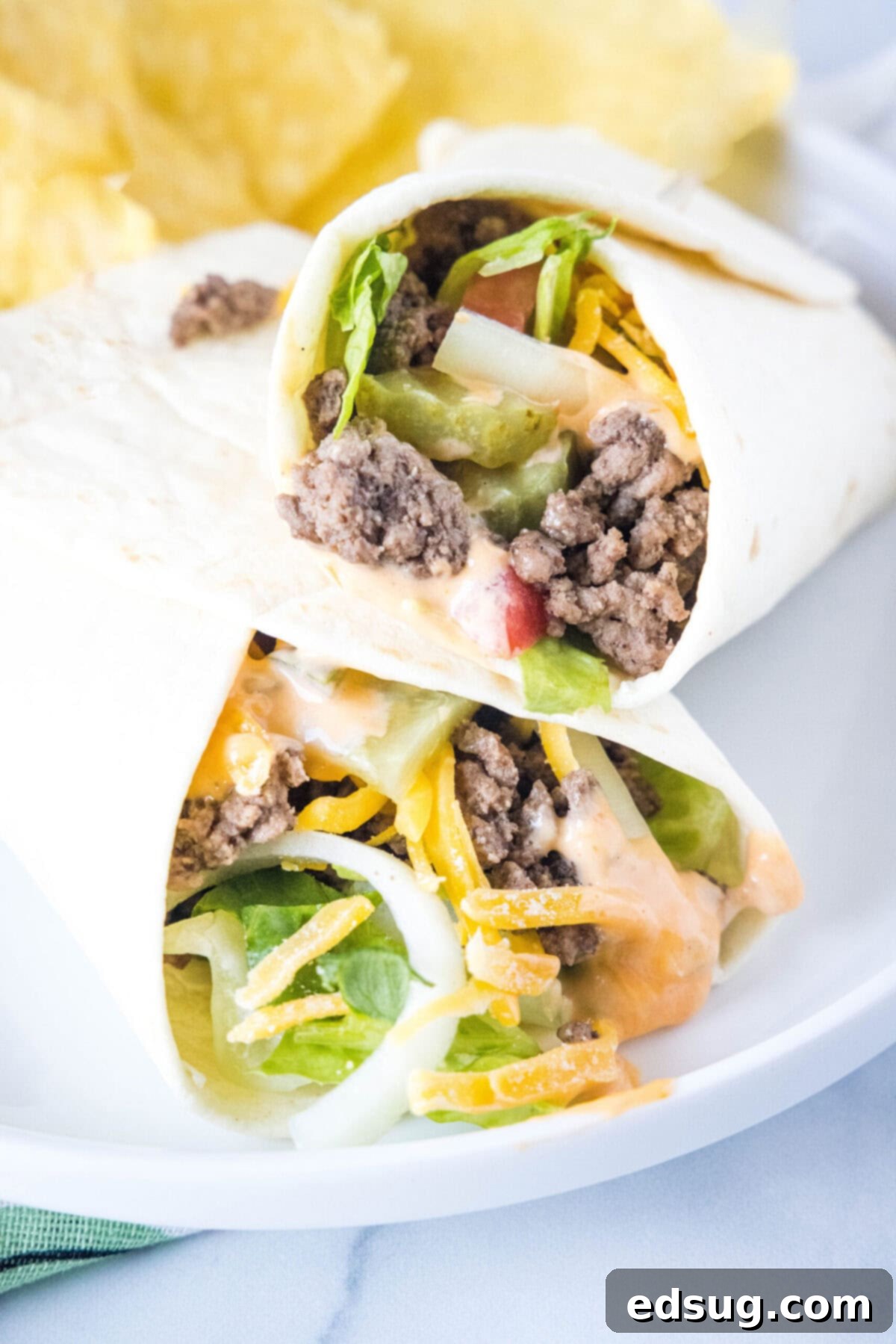 Close up of a burger wrap leaning on another burger wrap