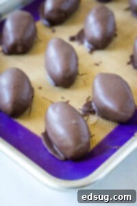 chocolate dipped footballs on baking tray