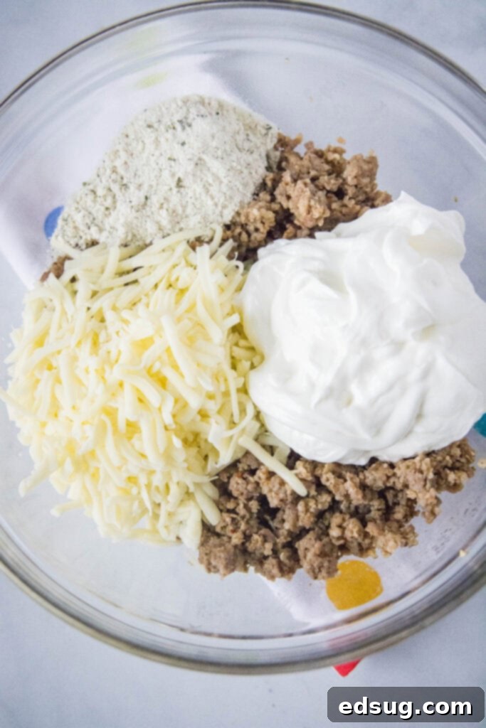 Savory Sausage Cups 3 sausage bite filling in a mixing bowl