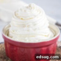 Close up of a ramekin full of stabilized whipped cream