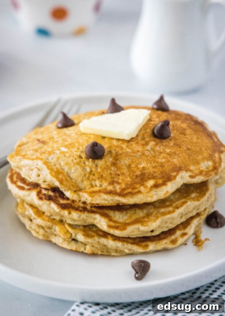 Wholesome Oat Pancakes 6 stack of oatmeal pancakes on a white plate, ready to be served