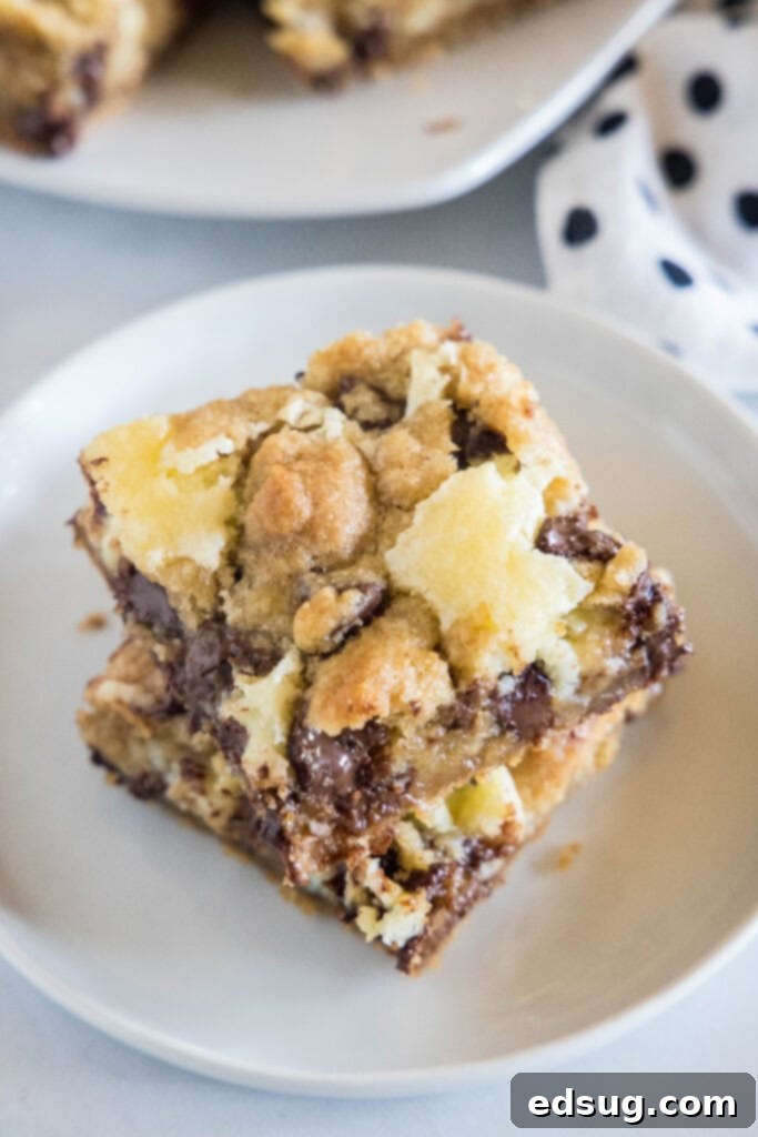 Choc-Chip Cheesecake Dream Bars 6 looking down on a plate of sliced cheesecake cookie bars