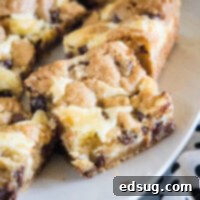 cropped close up chocolate chip cookie cheesecake bars