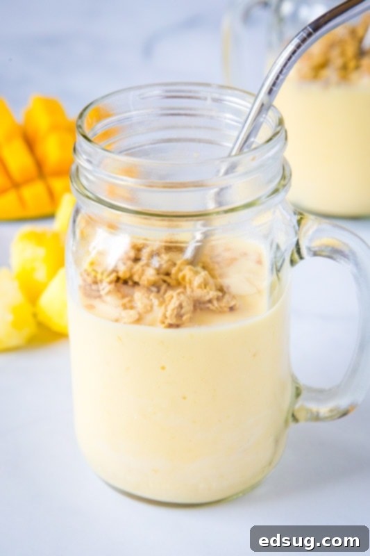 Tropical Mango Pineapple Smoothie 2 mango pineapple smoothie in a glass