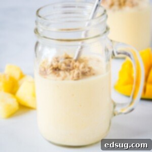 Mango Pineapple Smoothie - this tropical smoothie is a refreshing smoothie full of pineapple, mango, orange and lime juice.  It is like vacation for breakfast!