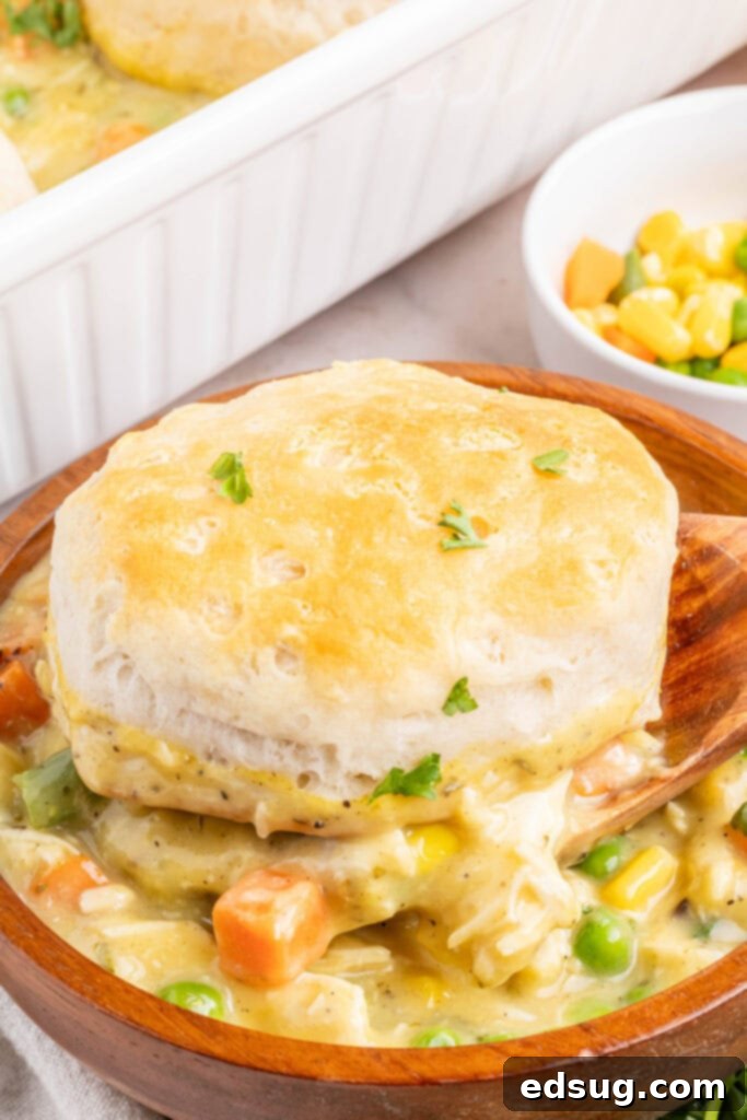 serving chicken pot pie casserole into a bowl