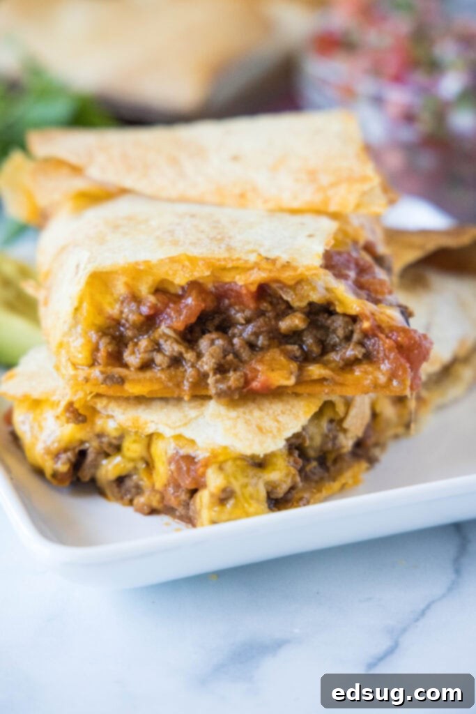 sheet tacos stacked on a plate