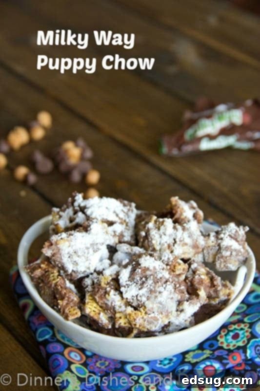 Milky Way Puppy Chow Recipe: A Sweet and Easy Treat Milky Way Puppy Chow in a vibrant blue bowl, perfectly coated in powdered sugar