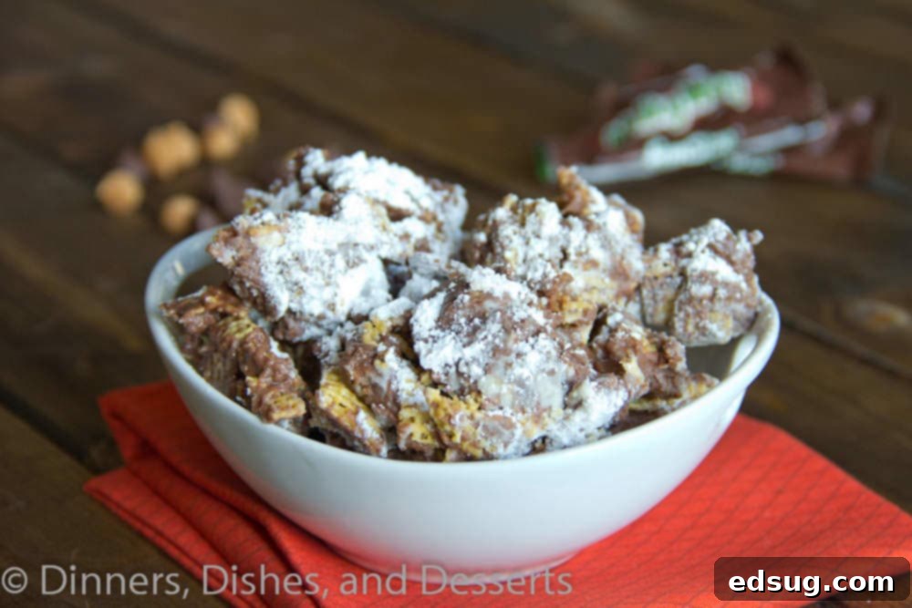 Milky Way Puppy Chow: Perfect for Parties and Quick Snacks Close-up of decadent Milky Way Puppy Chow with generous chocolate and caramel clumps