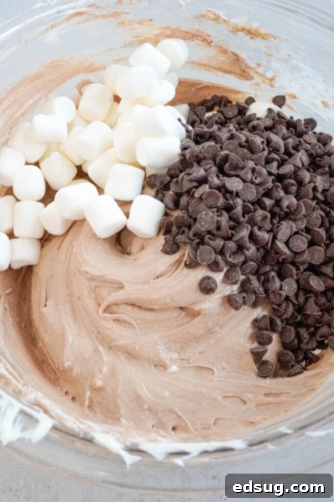 Decadent Hot Chocolate Dip 4 adding marshmallows and chocolate chips to hot chocolate dip