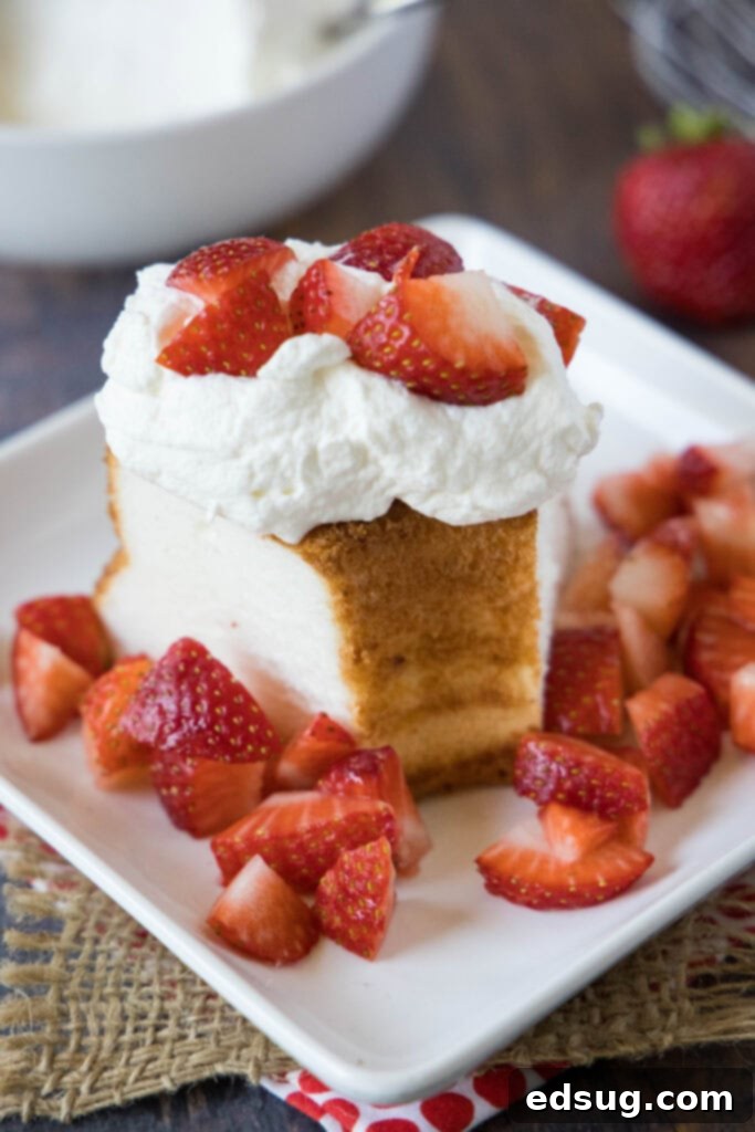 Fluffy Homemade Whipped Cream 6 whipped cream topping angel food cake with fresh strawberries, a classic dessert combination