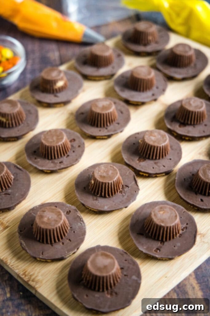 Charming Pilgrim Hat Delights 4 assembling pilgrim hat cookies on a board