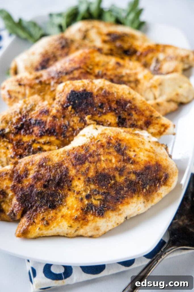plate with cooked chicken breasts with blackened seasoning