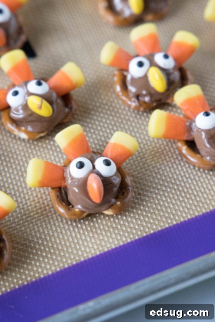 turkey pretzels assembled on a baking sheet