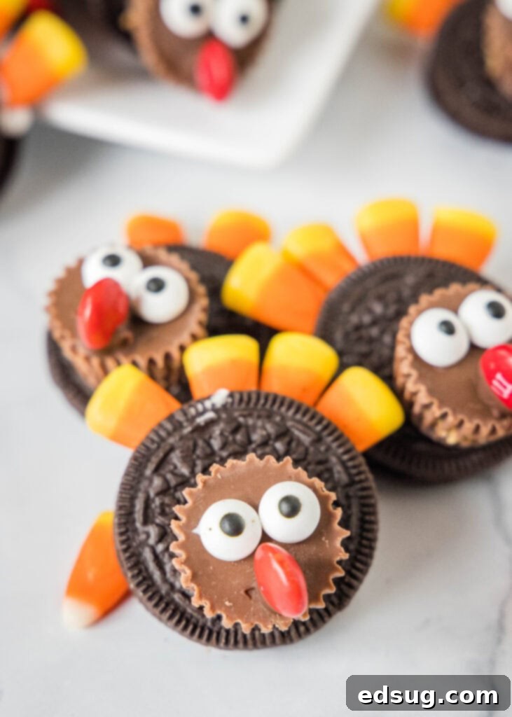 Thanksgiving Oreo Turkey Treats 6 A group of adorable Oreo turkey cookies standing together on a clean white surface, showcasing their festive designs and readiness for Thanksgiving.
