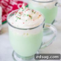 cropped close up cup of grinch hot chocolate