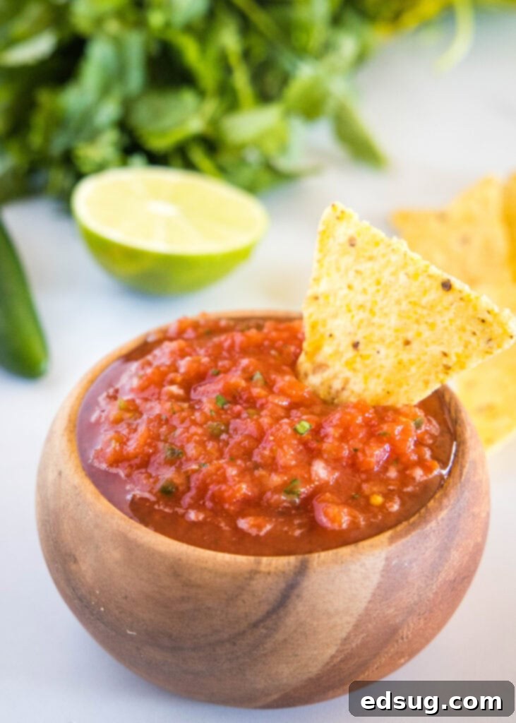 Signature Restaurant Salsa 2 bowl of salsa with chip in it