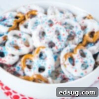 Cropped image of white chocolate covered pretzels with red, white, and blue sprinkles for 4th of July.