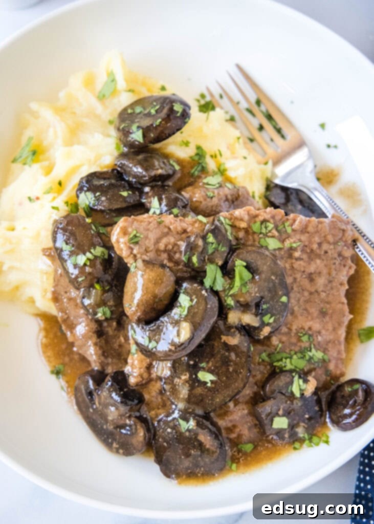 Tender Slow Cooker Cube Steak 6 looking down on a plate of crockpot cube steak
