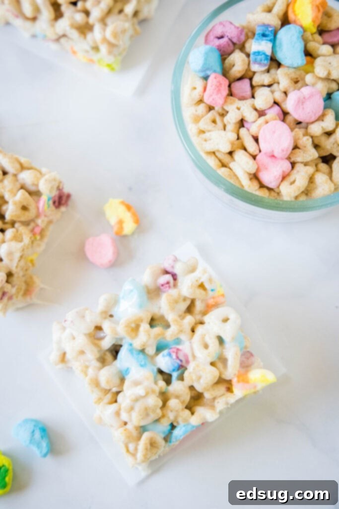 Lucky Charms Rainbow Krispie Delights 7 Overhead view of sliced Lucky Charms Rice Krispie Treats on a cutting board