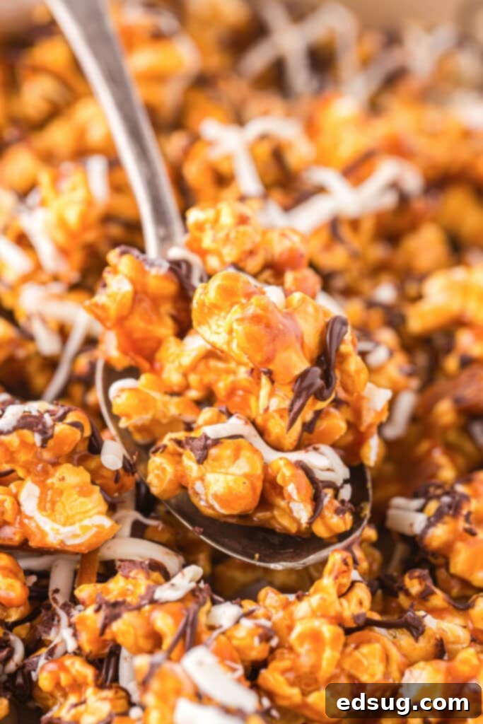 spooning zebra popcorn off a baking tray