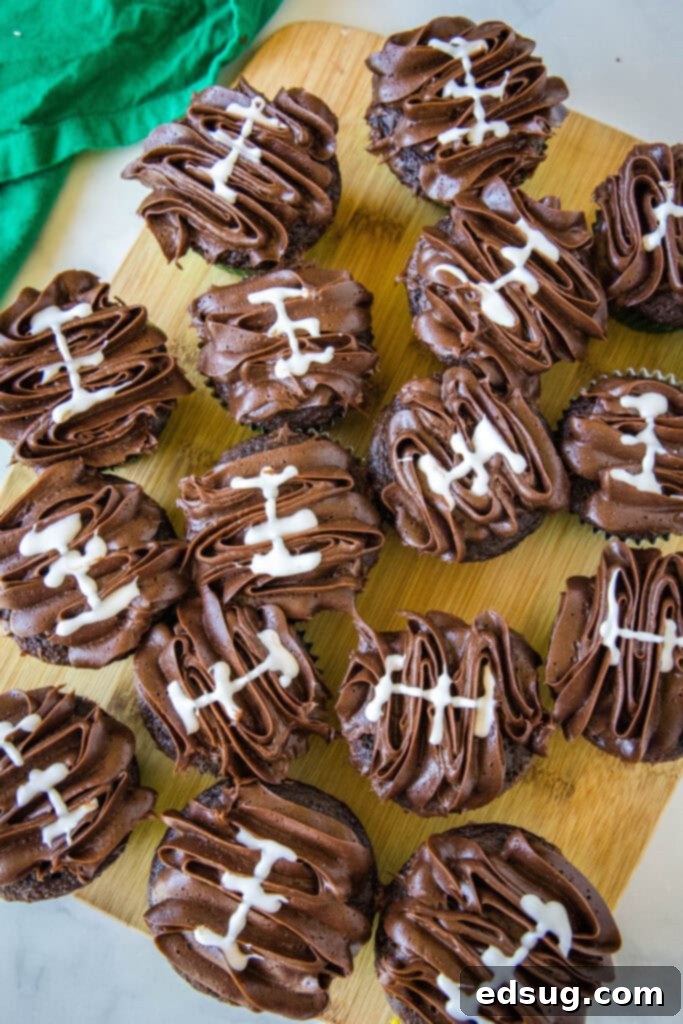 looking down on a tray of chocolate football cupcakes