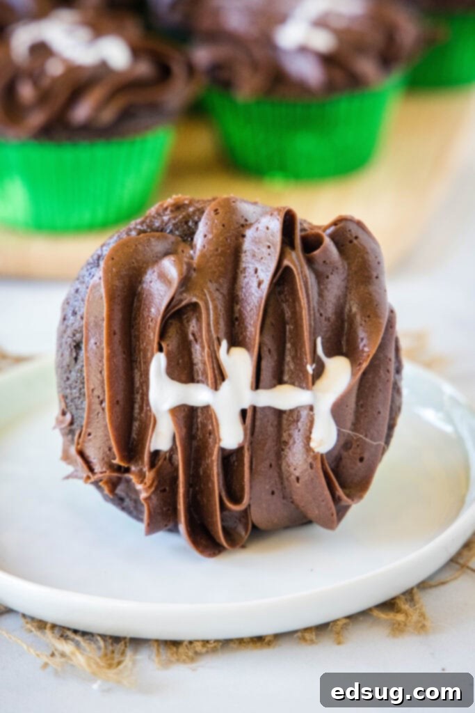 white plate with chocolate football cupcake