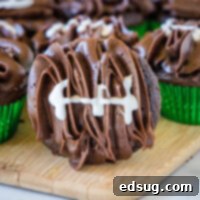 football cupcake on a cutting board