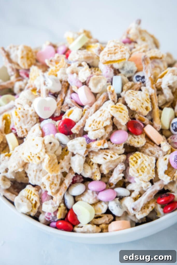 white bowl with valentine's day snack mix