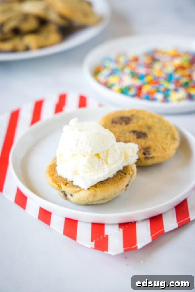 Applying ice cream onto a chocolate chip cookie