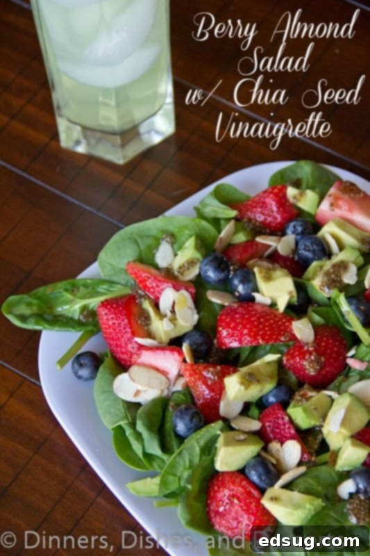 Berry Almond Salad with Chia Seed Vinaigrette berry almond salad with chia seed vinaigrette on a plate