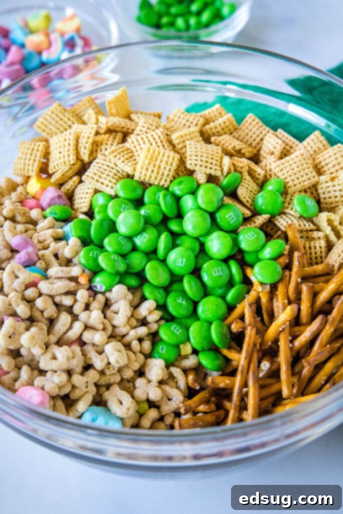 leprechaun bait cereal and pretzel mixture in a large bowl before adding chocolate