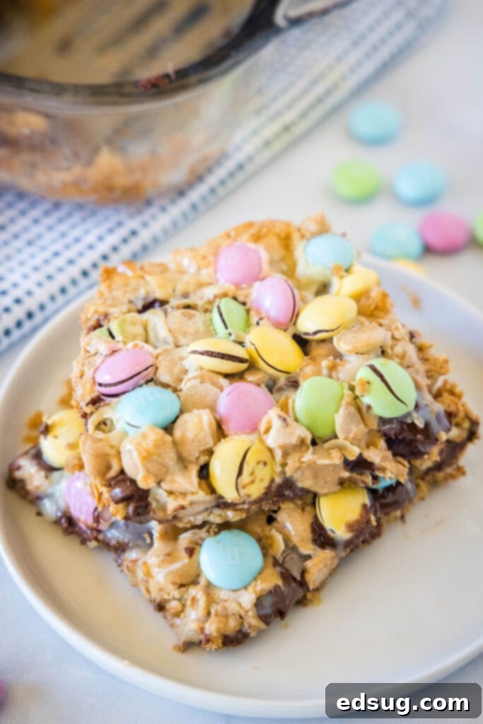 An overhead view of a white plate filled with perfectly baked and sliced Easter Magic Bars, ready to be enjoyed.