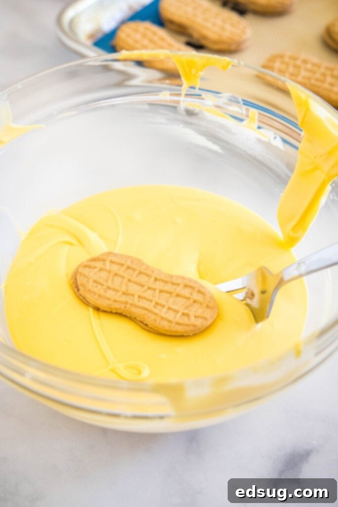 Peanut Butter Chick Delights 4 dipping nutter butter in yellow chocolate