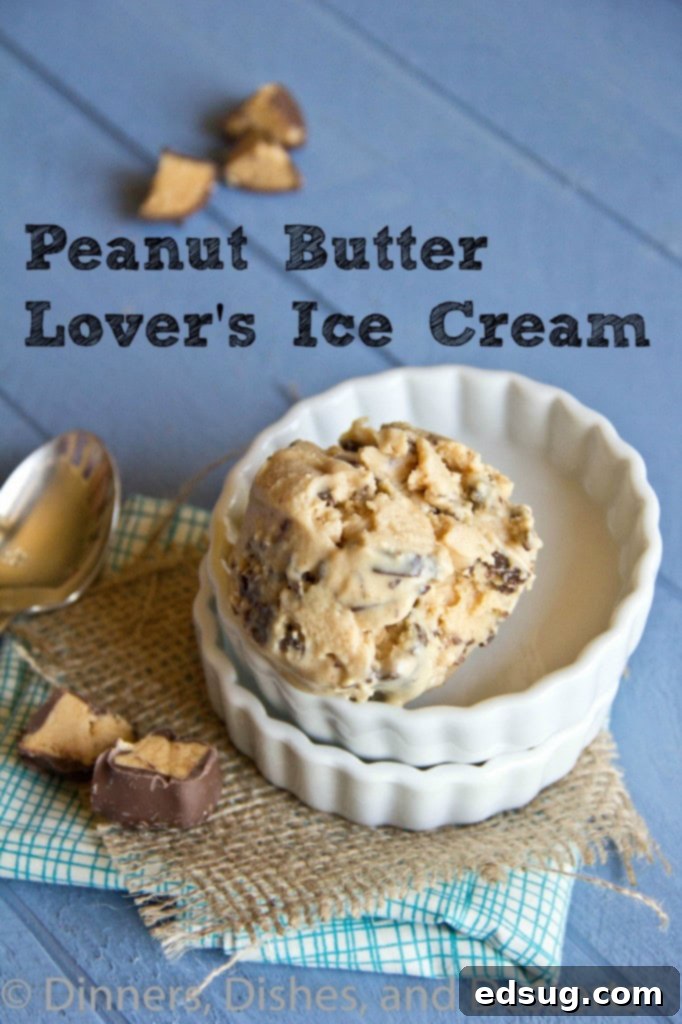 A scoop of homemade peanut butter cup ice cream in a bowl, garnished with chopped peanut butter cups.