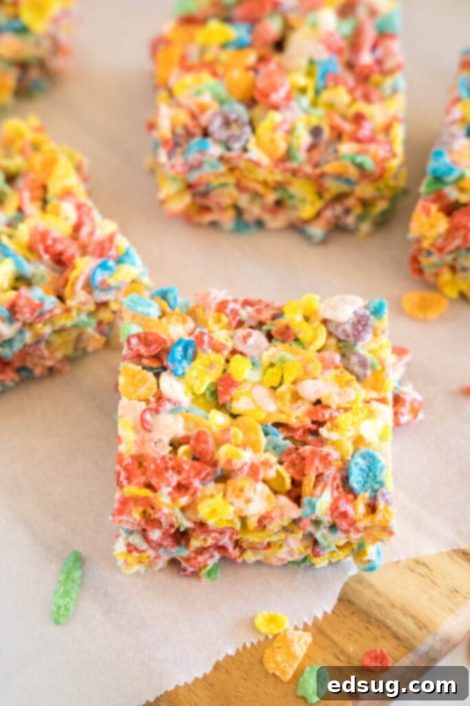 sliced fruity pebbles treats on a cutting board