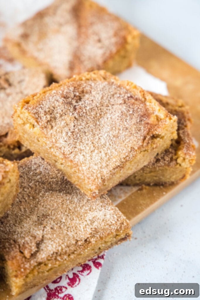 churro bars cut into squares on a cutting board