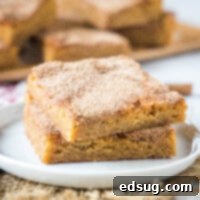 cropped close up stacked churro bars on a white plate