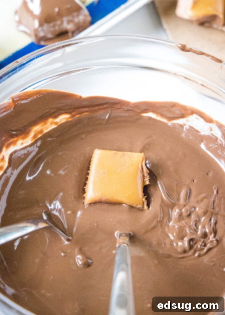 Copycat Milky Way Candy Bars 4 dipping candy in melted chocolate