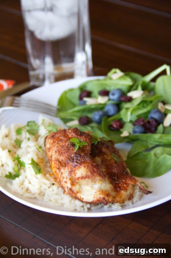 Spiced Chicken Thighs with Garlicky Rice spiced chicken thighs with garlicky rice on a plate