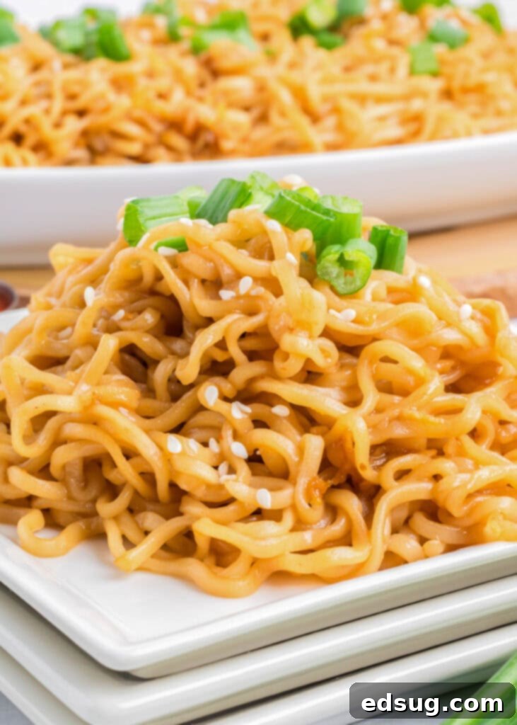 Savory Sesame Noodles 5 sesame noodles on a white plate with chopsticks