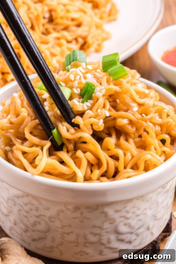 Savory Sesame Noodles 6 sesame noodles in a bowl with chop sticks and garnishes