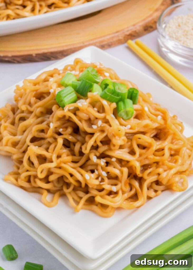 Savory Sesame Noodles 7 sesame noodles on a white plate ready to be eaten