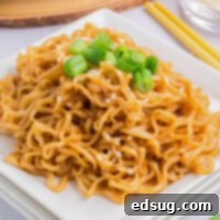 Savory Sesame Noodles 8 cropped close up sesame noodles on a plate with green onions